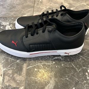 Men’s sz 14 black leather w/ red detail Puma shoes. Worn only once, like new